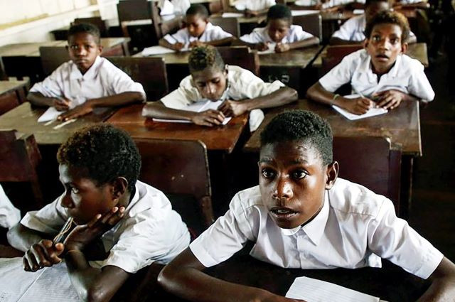 Learning the ropes: Papuan children learn to read and write on March 4, 2019, during a class at YPPK St. Agustinus elementary school in Manasari, Mimika regency, Papua.