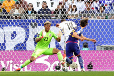 Iraq's forward #18 Aymen Hussein scores his team's second goal past Japan's goalkeeper #23 Zion Suzuki during the Qatar 2023 AFC Asian Cup Group D football match between Iraq and Japan at the Education City Stadium in Al-Rayyan, west of Doha on January 19, 2024. 