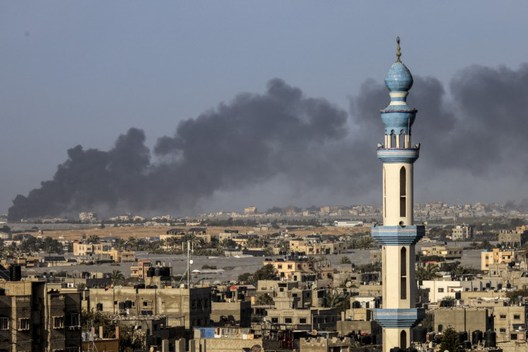 A picture taken from Rafah shows smoke billowing over Khan Yunis in the southern Gaza Strip during Israeli bombardment on January 22, 2024, amid ongoing battles between Israel and the Palestinian militant group Hamas.