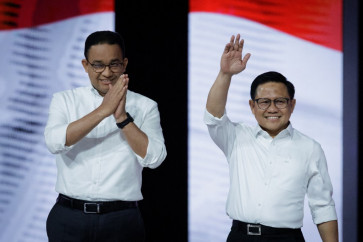 Presidential candidate Anies Baswedan (left) and vice presidential candidate Muhaimin Iskandar attend the second vice presidential election debate at the Jakarta Convention Center (JCC) in Jakarta on Jan. 21, 2024.