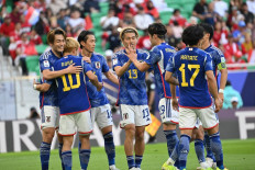Japanese players celebrate after forward Ayase Ueda scored his second goal during the Qatar 2023 AFC Asian Cup Group D soccer match between Japan and Indonesia at al-Thumama Stadium in Doha on Jan. 24, 2024.