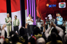 Presidential candidate pair Anies Baswedan (third left) and Muhaimin Iskandar (third right) embrace each other on Jan. 21, 2024, while other candidate pairs Ganjar Pranowo-Mahfud MD (left) and Prabowo Subianto-Gibran Rakabuming Raka (right) look on, after the second 2024 vice presidential debate at Jakarta Convention Center (JCC) in Jakarta.