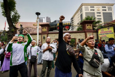 Indonesian Muslims shout slogans as they take part in a protest in front of the police headquarters in Jakarta on Nov. 10, 2023 to demand the cancellation of the Nov. 15 concert by British rock band Coldplay, whom protesters say are supportive of LGBT rights, which goes against Muslim doctrines.