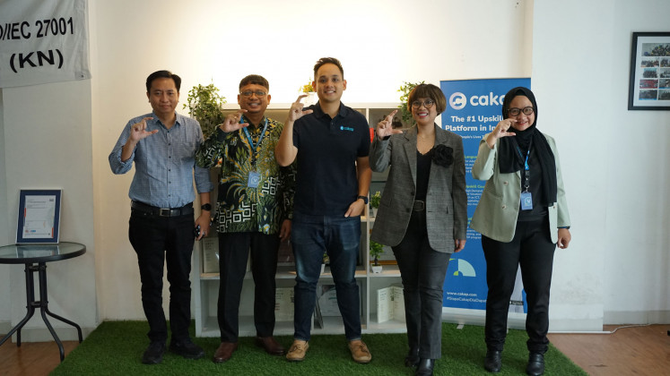 Representatives from Cakap, SGS Indonesia and Siggap after the certificate presentation at the Cakap headquarters in the Grogol area of West Jakarta.