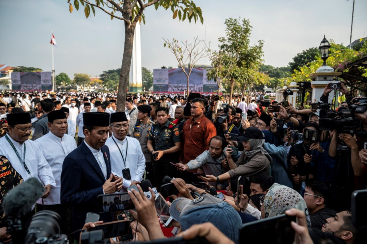 President Joko “Jokowi“ Widodo (center) accompanied by Defense Minister Prabowo Subianto (second left) and Nahdlatul Ulama (NU) Chairman Yahya Cholil Staquf (fourth left) attend the commemoration of National Santri Day on Oct. 22, 2023, in Surabaya, East Java.