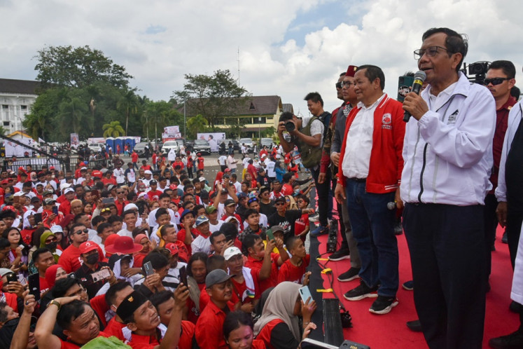 Vice presidential candidate Mahfud MD (right) delivers a speech during a campaign event at Astaka Square in Medan, North Sumatra, on Jan. 28, 2024.
