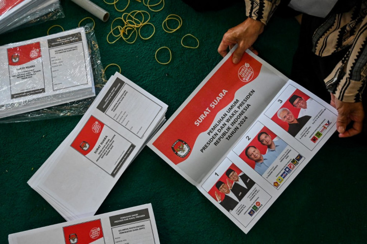 A worker sorts and folds ballot papers for the presidential election organized by an independent election commission on Jan. 18, 2024, in Banda Aceh, Aceh, ahead of Indonesia's upcoming general election scheduled for Feb. 14.
