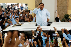 Indonesian defense minister and presidential candidate Prabowo Subianto salutes his supporters after attending a campaign rally in Jakarta on Jan. 26, 2024.