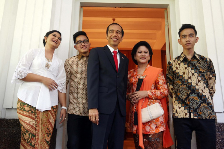 President Joko “Jokowi“ Widodo (center) stands with First Lady Iriana (second right), son Gibran Rakabuming (right), daughter Kahiyang Ayu (left) and Kaesang Pangarep (second left) on Oct. 20, 2014, for an unofficial portrait of the First Family at the Jakarta governor's residence, shortly before the official inauguration at the House of Representatives.
