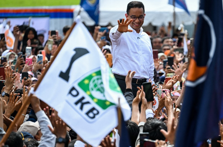 Presidential candidate Anies Baswedan (in white) waves during his election campaign in Banda Aceh on Jan. 27, 2024, ahead of the country's presidential and legislative polls scheduled to be held on Feb. 14.