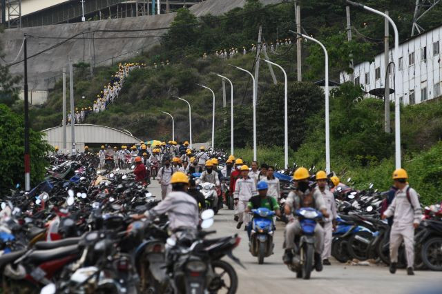 Workers start departing at the end of their workday on Jan. 26, 2024, from a parking lot at the Indonesia Morowali Industrial Park (IMIP) in Bahodopi district, Morowali regency, Central Sulawesi.
