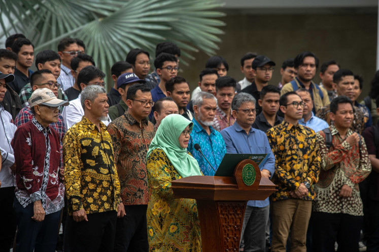 Professors and students of Yogyakarta Muhammadiyah University (UMY) deliver a speech at the university's campus in Bantul, Yogyakarta, on Feb. 3, 2024. 