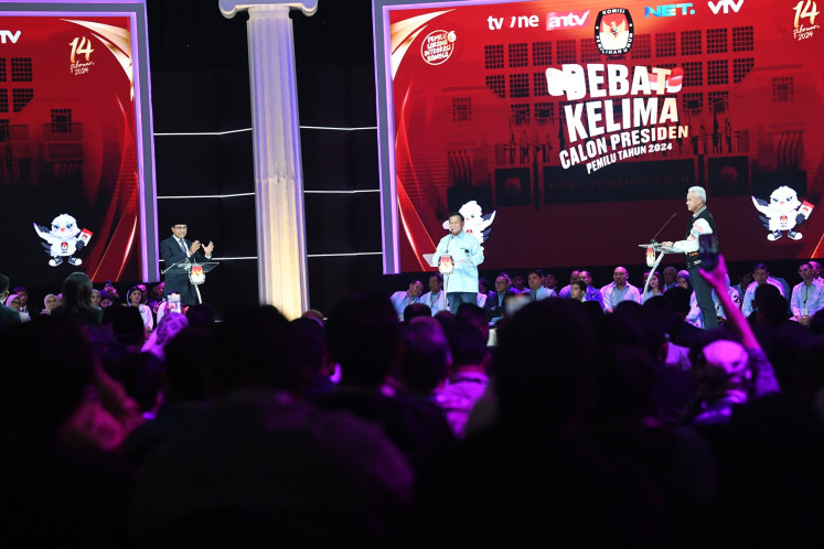 Presidential candidates (from left to right) Anies Baswedan, Prabowo Subianto and Ganjar Pranowo stand on the stage during the final 2024 presidential debate at Jakarta Convention Center (JCC) in Senayan, Central Jakarta on Feb. 4, 2024.