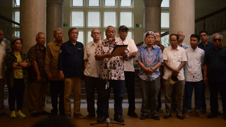 A group of lecturers, alumni and students of Gadjah Mada University gather at the university campus on Jan. 31, 2024 to express their concern about President Joko “Jokowi” Widodo’s intervention in the election process, which they say is a threat to democracy.