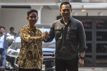 Gibran Rakabuming Raka (left) shakes hands with Democratic Party chairman Agus Harimurti Yudhoyono after a meeting in Jakarta, on Oct. 10, 2023. Vice presidential candidate Gibran visited Agus and his father, former president Susilo Bambang Yudhoyono in their residence in Cikeas, Bogor regency, West Java, on Feb. 5, 2024 to discuss election matters. 