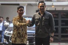 Gibran Rakabuming Raka (left) shakes hands with Democratic Party chairman Agus Harimurti Yudhoyono after a meeting in Jakarta, on Oct. 10, 2023. Vice presidential candidate Gibran visited Agus and his father, former president Susilo Bambang Yudhoyono in their residence in Cikeas, Bogor regency, West Java, on Feb. 5, 2024 to discuss election matters. 