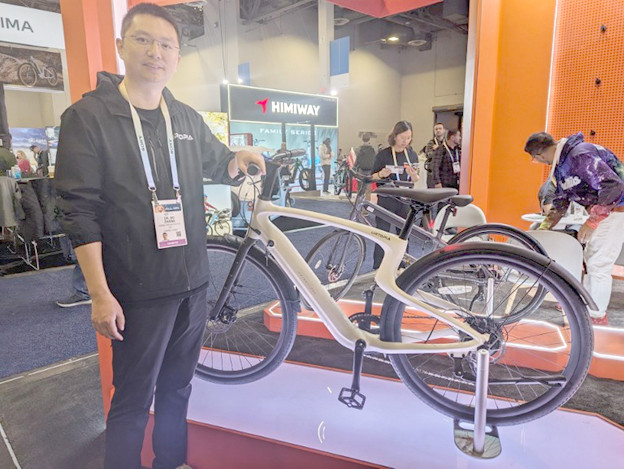Urtopia chief executive Bo Zhang poses with an electric bicycle with chatbot capabilities powered by OpenAI’s ChatGPT at the Consumer Electronics Show in Las Vegas, Nevada, on Jan. 10, 2024.