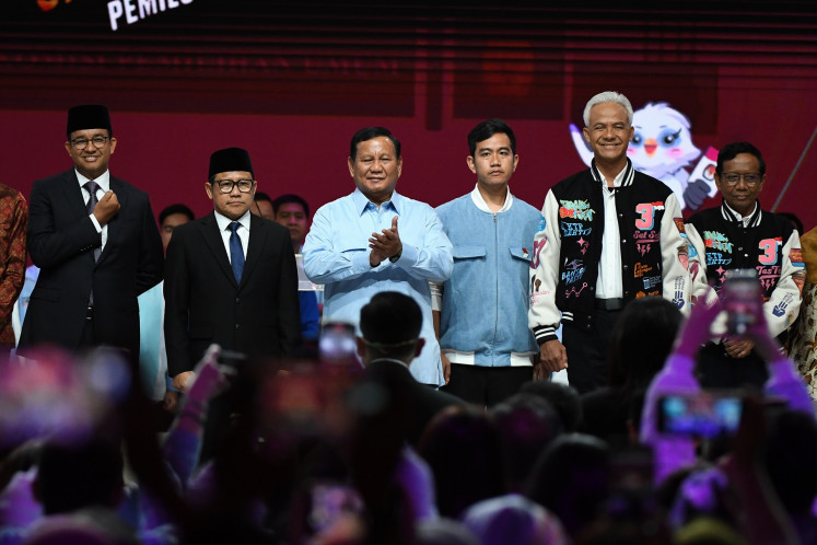 (From left to right) Presidential candidate Anies Baswedan and his running mate Muhaimin Iskandar; presidential candidate Prabowo Subianto and running mate Gibran Rakabuming Raka and presidential candidate Ganjar Pranowo and running mate Mahfud MD stand on stage after the final 2024 election debate at Jakarta Convention Center (JCC) in Jakarta on Feb. 4, 2024.