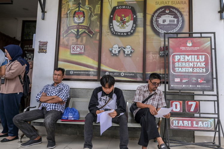 Residents wait in line on Feb. 7, 2024, to update their voter registration details so that they can vote at polling stations other than where they are registered, at the North Jakarta Elections Commission (KPU) office in Jakarta. The KPU allowed voters to change their voting details until midnight on Feb. 7.