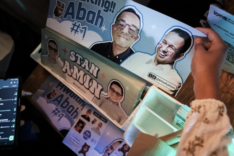 Campaign merchandise made in the style of Korean pop music (K-pop) are sold during a campaign rally for presidential candidate Anies Baswedan and vice presidential candidate Muhaimin Iskandar, organised by youth volunteers in Jakarta on February 8, 2024. 