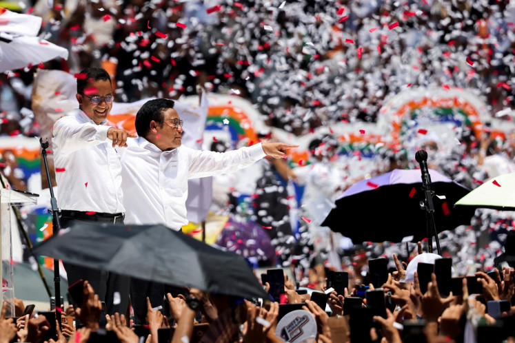 Presidential candidate Anies Baswedan and his running mate Muhaimin Iskandar greet their supporters during their final campaign rally at the Jakarta International Stadium (JIS) in Jakarta on Feb. 10, 2024.