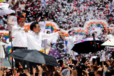 Presidential candidate Anies Baswedan and his running mate Muhaimin Iskandar greet their supporters during their final campaign rally at the Jakarta International Stadium (JIS) in Jakarta on Feb. 10, 2024.