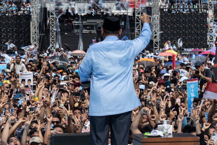 Presidential candidate Prabowo Subianto (center) speaks during a campaign rally at the Gelora Bung Karno Stadium in Jakarta on February 10, 2024. 