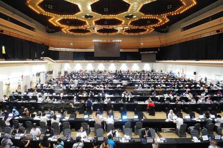 Indonesian citizens register to cast their votes for the 2024 general election at the Kuala Lumpur World Trade Center in Malaysia on Feb. 11, 2024.