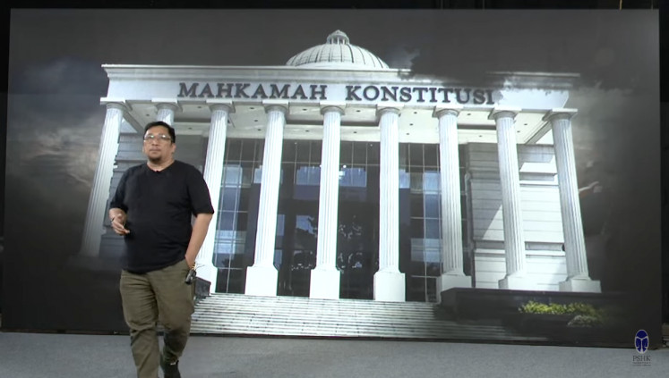 A still of the Constitutional Court from the documentary film ‘Dirty Vote’, released on YouTube on Feb. 11, 2024, is projected on a screen.