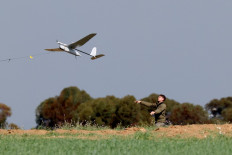 An Israeli army soldier launches a drone from a field in southern Israel along the border with the Gaza Strip on January 24, 2024 amid ongoing battles between Israel and the Palestinian militant group Hamas. 