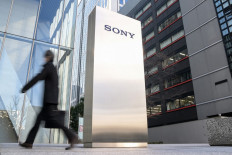 Sony hikes net profit forecast, will list financial services unit