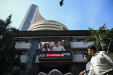 Pedestrians walk past the Bombay Stock Exchange (BSE) building in Mumbai on January 23, 2024. India's stock market has edged out Hong Kong to become the world's fourth-largest, a milestone that underscores growing global investor optimism about New Delhi's economic prospects, Bloomberg said on Jan. 23.