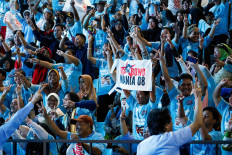 Supporters of Indonesia's Defense Minister and leading Presidential candidate Prabowo Subianto, and his running mate Gibran Rakabuming Raka, the eldest son of Indonesian President Joko 'Jokowi' Widodo and current Surakarta's Mayor, cheer during an event to watch the results of the general election in Jakarta, February 14, 2024. 