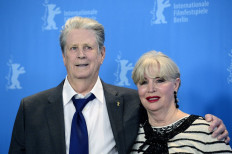 Former Beach Boy Brian Wilson (left) and his wife Melinda Ledbetter pose for photographers during the photocall for the film “Love & Mercy“ presented in the Berlinale Special of the 65th Berlin International Film Festival Berlinale in Berlin, on February 8, 2015. 