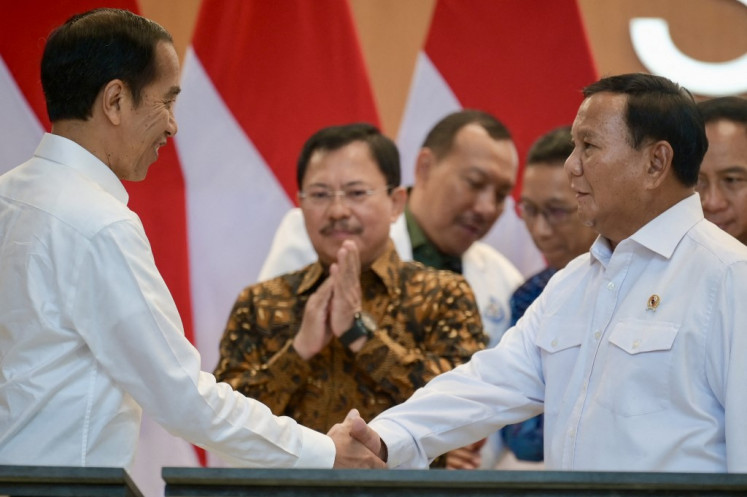 President Joko “Jokowi“ Widodo (left) and Defense Minister Prabowo Subianto shake hands on Feb. 19, 2024, during the inauguration of the Soedirman National Defense Central Hospital (RSPPN) in Pesanggrahan, South Jakarta.