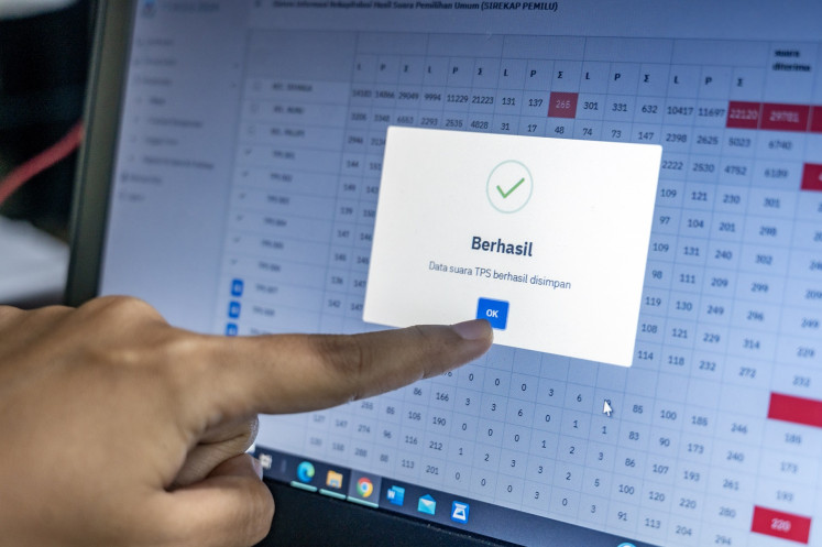 District Polling Committee (PPK) officials enter vote counting data into the Tabulation Information System (Sirekap) on Feb. 21, 2024, in Palu, Central Sulawesi.
