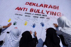 Stop bullying: Students of the Lazuardi Kamila Global Compassionate School (SCS) in Surakarta, Central Java stamp their hands on a banner on Jan. 2, 2024 during an anti-bullying campaign. 