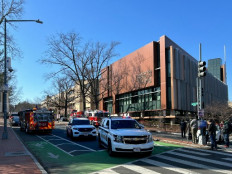 United States Secret Service vehicles block access to a street leading to the Israel Embassy in Washington, DC on Feb. 25, 2024. An active member of the US Air Force has died after setting himself on fire outside the embassy over the weekend in protest of the war in Gaza, the Pentagon said Feb. 26, 2024.