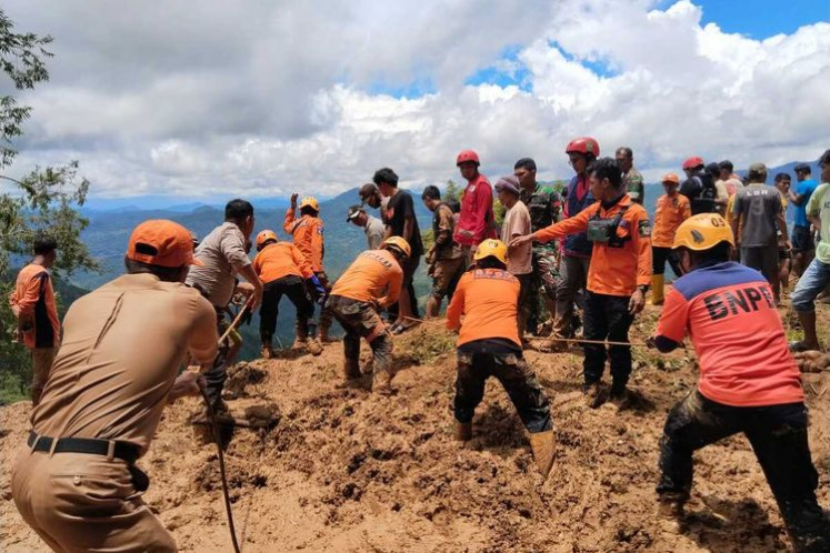 Search and rescue team members try to look for survivors after landslide hits Bastem, Luwu regency in South Sulawesi on Feb. 26, 2024. 