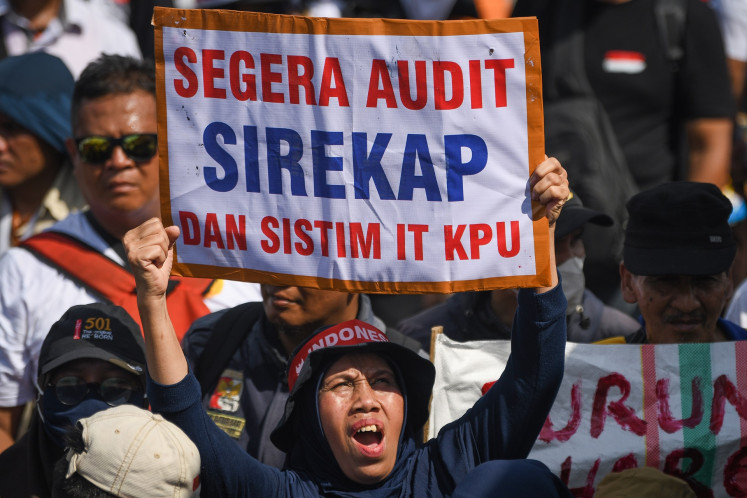 Demonstrators gather on March 1, 2024, outside the House of Representatives complex in Senayan, Jakarta, to denounce the Feb. 14 general election as a sham. The protestors demanded the dismissal of the General Elections Commission (KPU) leadership and supported a planned legislative investigation into allegations of poll rigging.