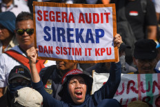 Demonstrators gather on March 1, 2024, outside the House of Representatives complex in Senayan, Jakarta, to denounce the Feb. 14 general election as a sham. The protestors demanded the dismissal of the General Elections Commission (KPU) leadership and supported a planned legislative investigation into allegations of poll rigging.