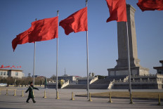 A Chinese paramilitary police officer walks at Tiananmen Square in Beijing on March 3, 2024, ahead of the country's annual legislative meetings known as the “Two Sessions“.