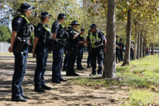 Police are briefed outside the venue for the Australia-ASEAN (Association of Southeast Asian Nations) summit in Melbourne on March 4, 2024. 