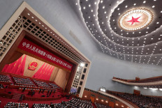 Chinese Premier Li Qiang delivers the work report at the opening session of the National People's Congress (NPC) at the Great Hall of the People in Beijing on March 5, 2024.