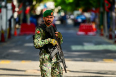 A Maldives' Army soldier stands guard ahead of the inaguration of Maldives' president-elect Mohamed Muizzu ahead of the inauguration ceremony in Male on November 17, 2023. President Mohamed Muizzu of the Maldives vowed on November 17 to expel Indian troops deployed in the strategically located archipelago, in his first speech to the nation after being sworn into power. 