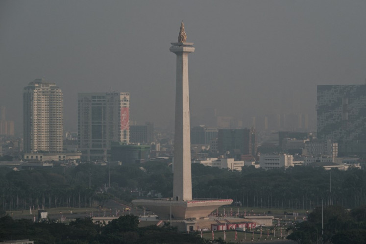 The National Monument (Monas) is seen in the haze caused by the air pollution in Jakarta on August 16, 2023.