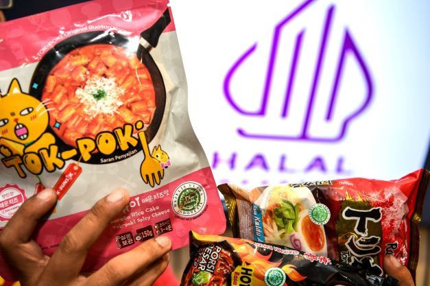 The government’s new halal logo is seen on March 14, 2022, on packages of imported instant noodles.