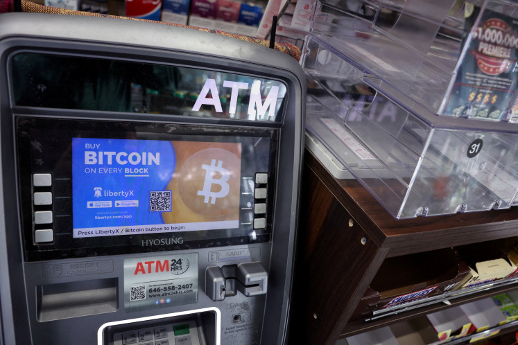 A Bitcoin ATM sits in the corner of a store in New York City, US, on March 5, 2024. 