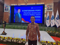 Investment Minister Bahlil Lahadalia poses for a photo after a press briefing at his office in Jakarta on March 18, 2024.