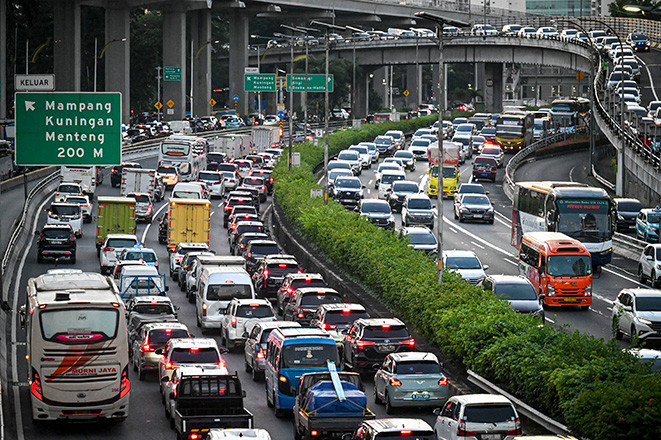 Motorists sit in a traffic on March 19, 2024, on Jl. Gatot Subroto in Jakarta. 